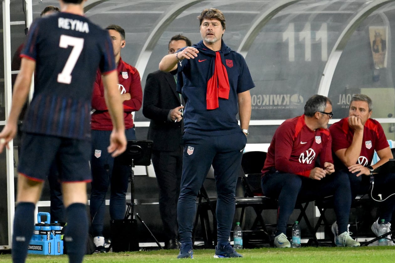 United States head coach Mauricio Pochettino (center) speaks to Gil Reyna during the second half of an international friendly soccer game against Uruguay on Tuesday, Nov. 18, 2025, in Tampa, Fla. (Jason Behnken/AP)