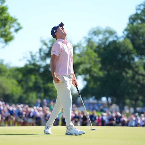 Russell Henley reacts after sinking a putt on the 18th hole during the final round of the Charles Schwab Challenge golf tournament at Colonial Country Club in Fort Worth, Texas, Sunday, May 31, 2026. (AP Photo/LM Otero)