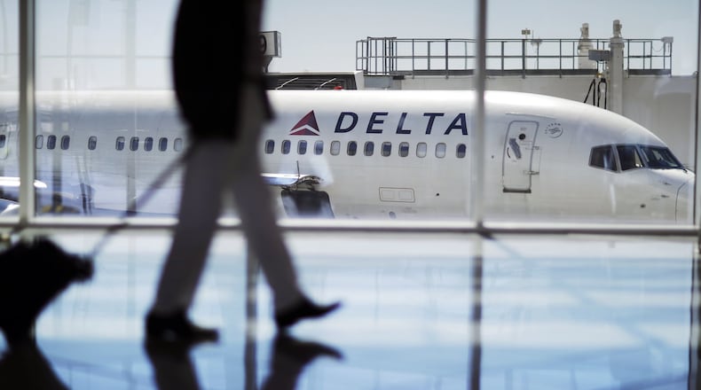 A Delta Air Lines jet at a gate at Hartsfield-Jackson, which is taking the first steps toward its newest planned gate complex, to be called Concourse G. (AP Photo/David Goldman)