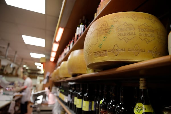 FILE - Wheels of Parmesan cheese are stored in a deli in Rome, Thursday, Oct. 3, 2019. (AP Photo/Alessandra Tarantino, File)