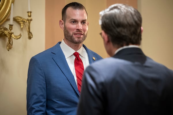 U.S. Rep. Clay Fuller chats with House Speaker Mike Johnson ahead of a ceremonial swearing in ceremony earlier this month. (Nathan Posner for the AJC)
