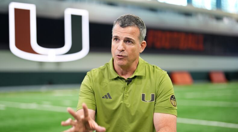 Miami football head coach Mario Cristobal speaks during an interview on the team's indoor practice field in Coral Gables, Fla., Monday, Jan. 12, 2026. (AP Photo/Rebecca Blackwell)