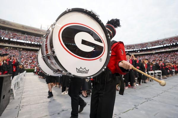 Members of the University of Georgia Redcoat Marching Band perform during this year's Spring Undergraduate Commencement at Sanford Stadium. (Jason Getz/AJC)