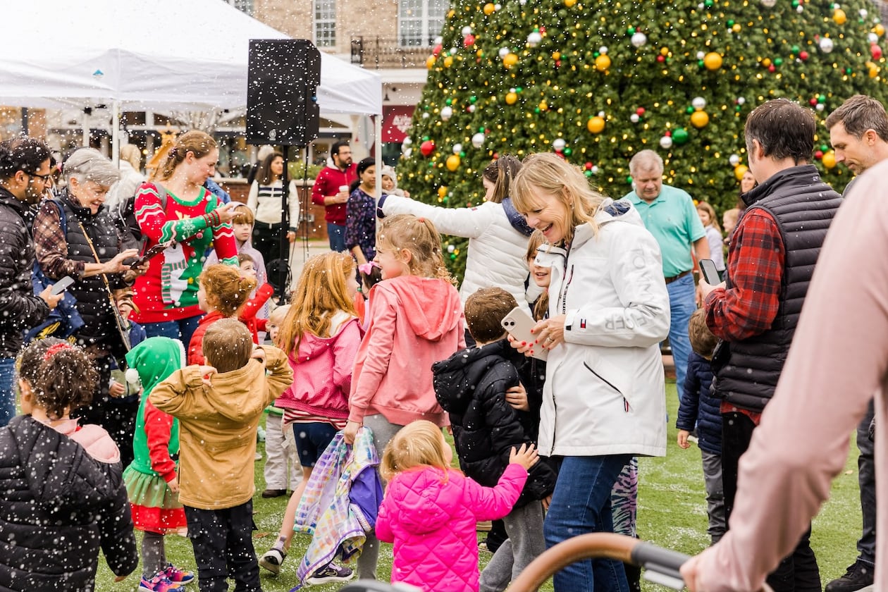 Play in a winter scene created by snow machines on Saturday in Alpharetta. (Courtesy of Alpharetta City Center)