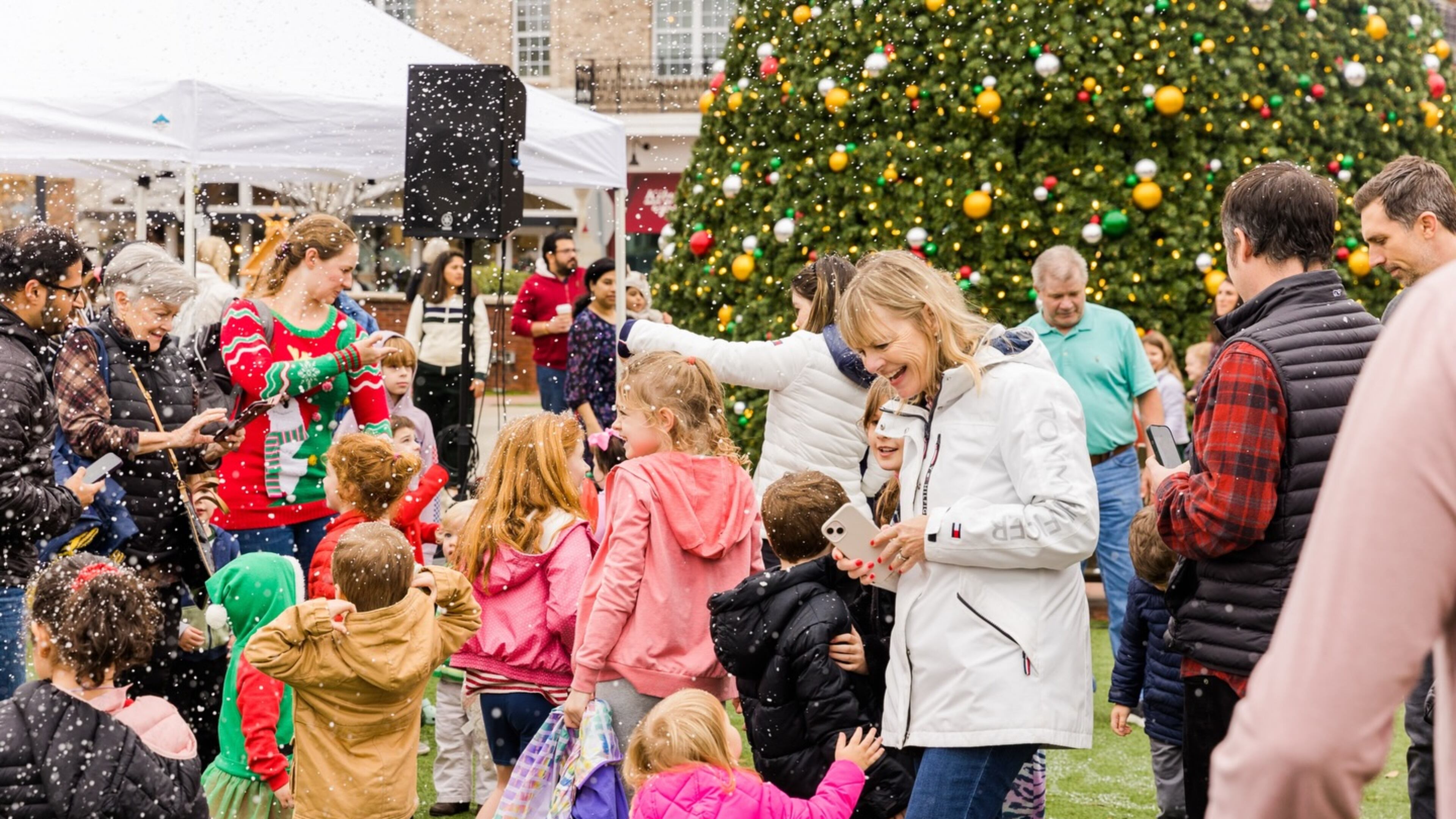 Play in a winter scene created by snow machines on Saturday in Alpharetta. (Courtesy of Alpharetta City Center)