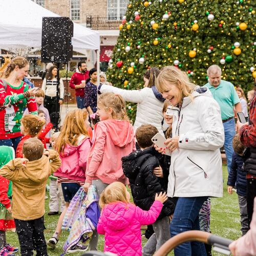 Play in a winter scene created by snow machines on Saturday in Alpharetta. (Courtesy of Alpharetta City Center)