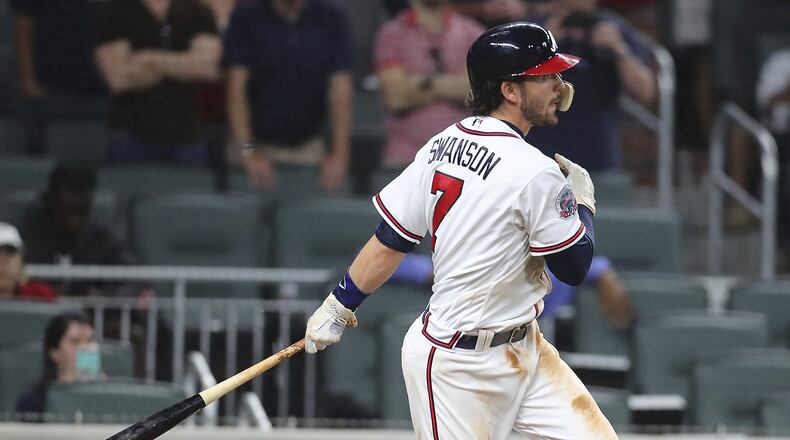 Braves shorstop Dansby Swanson drives in the game-winning run with a base hit against Padres on April 17. (Curtis Compton/Atlanta Journal-Constitution via AP)