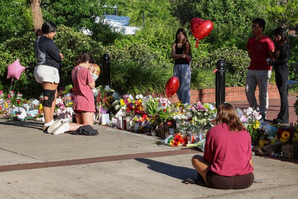 Students gather on a stretch of sidewalk near the center of the Florida State campus in sight of the Student Union building, Tallahassee, Fla., Friday, April 18, 2025. (AP Photo/Gary McCullough)