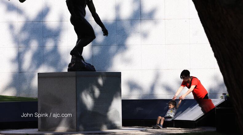 Sebastian Moreno, 2, with mom, Maria Urrutia, playing at the High Museum of Art on May 14, 2018.