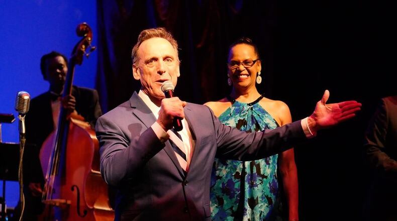 In this photo Tom Key presides over a gala fund-raiser at the Theatrical Outfit from a past year. This year's gala will take place online, where Key, retiring after 25 years as artistic director, will be honored. CONTRIBUTED: THEATRICAL OUTFIT