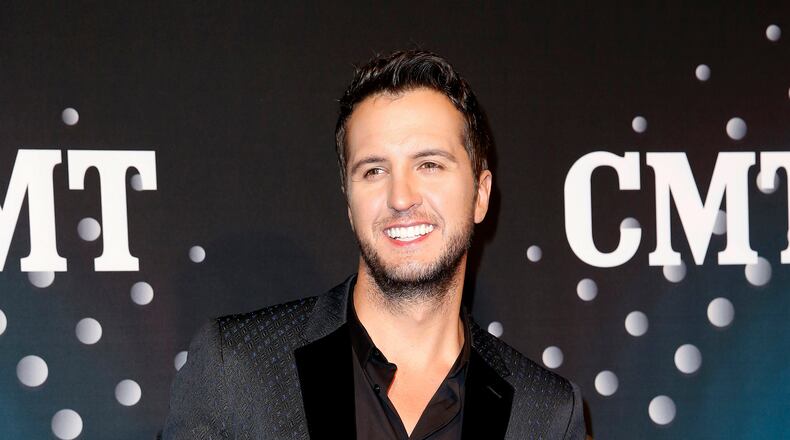 In this Dec. 3, 2013 file photo, Luke Bryan poses on the red carpet at the CMT "Artists of the Year" at Bridgestone Arena, in Nashville, Tenn. (Photo by Donn Jones/Invision/AP, File) In this Dec. 3, 2013 file photo, Luke Bryan poses on the red carpet at the CMT "Artists of the Year" at Bridgestone Arena, in Nashville, Tenn. (Photo by Donn Jones/Invision/AP, File)
