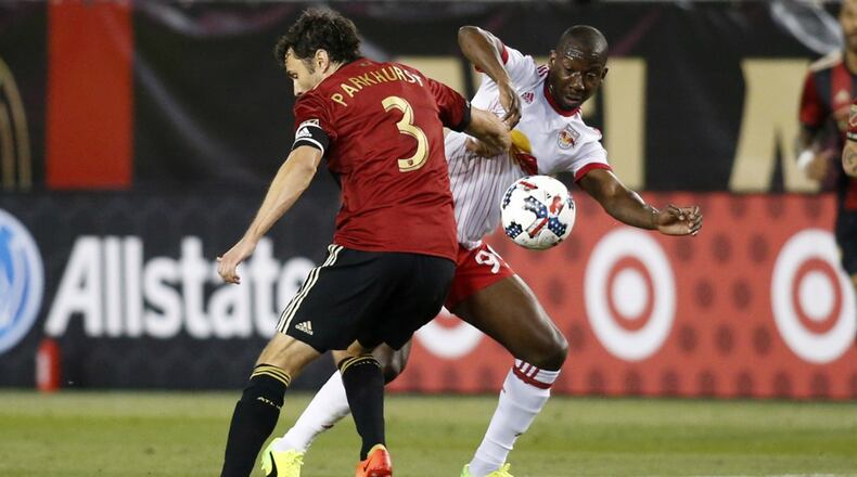 New York Red Bulls’ Bradley Wright-Phillips battles for a ball with Atlanta United’s Michael Parkhurst.