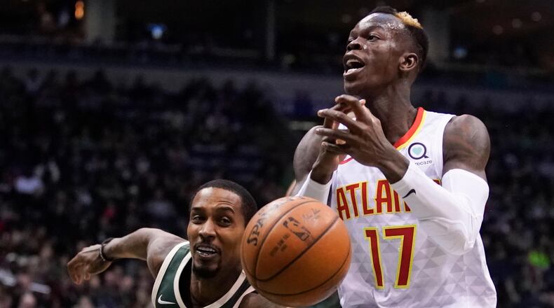 Milwaukee Bucks' Brandon Jennins knocks the ball from Atlanta Hawks' Dennis Schroder during the second half of an NBA basketball game Saturday, March 17, 2018, in Milwaukee. (AP Photo/Morry Gash)