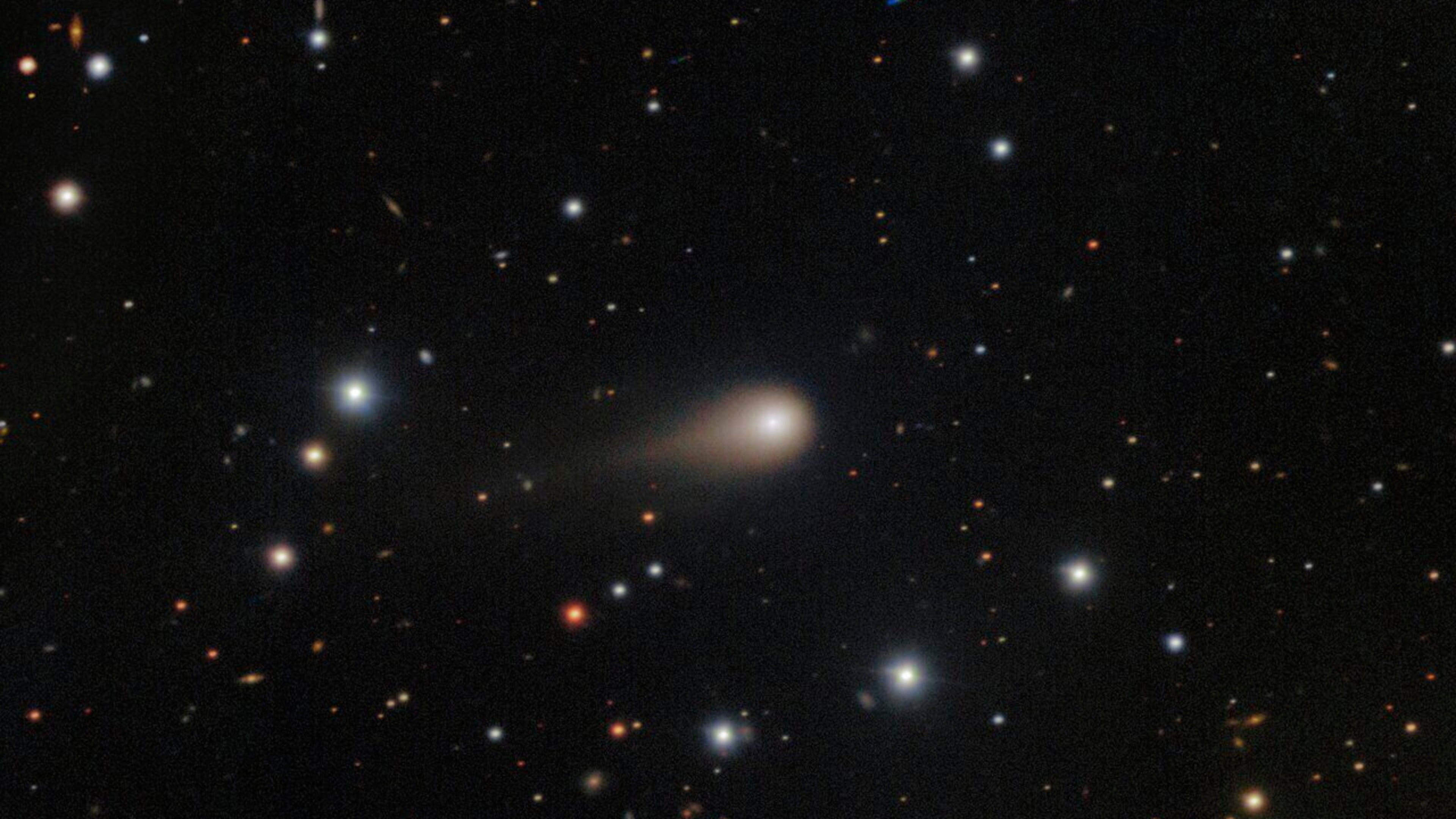 This image composed from multiple exposures and provided by NSF's NOIRLab shows a comet streaking across a star field above the International Gemini Observatory on Cerro Pachon, near La Serena, Chile. (NSF's NoirLab via AP)