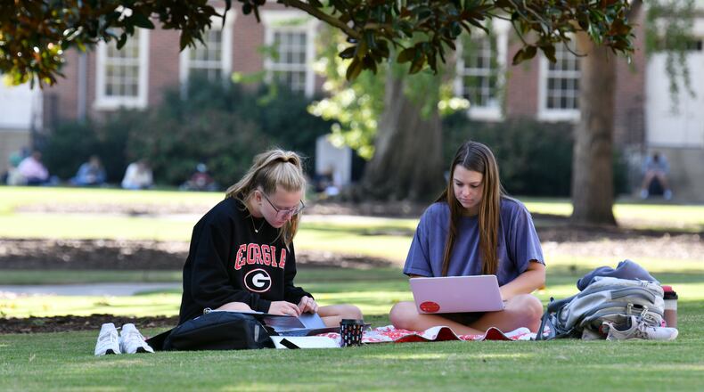 University of Georgia students Elizabeth Appleton (left), freshman, and Sarah Kearney, sophomore, work on their school work on Wednesday, September 23, 2020. (Hyosub Shin / Hyosub.Shin@ajc.com)