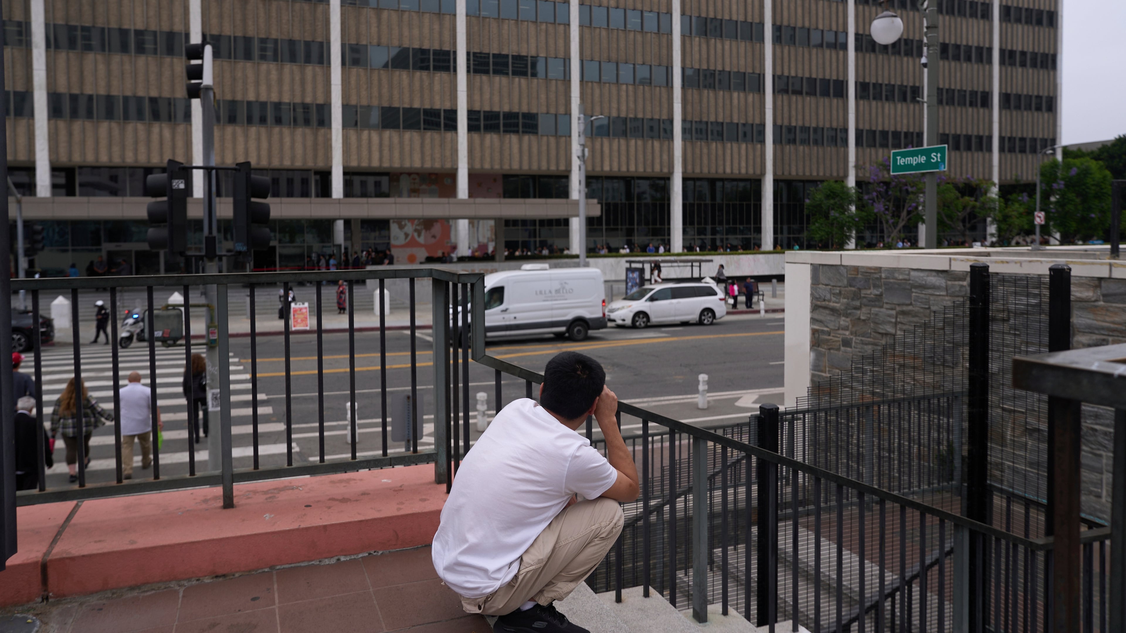 FILE - People line up outside the Los Angeles Federal Building in Los Angeles, housing the U.S. Immigration and Customs Enforcement (ICE) and U.S. Citizenship and Immigration Services (USCIS) on Wednesday, June 25, 2025. (AP Photo/Damian Dovarganes, file)