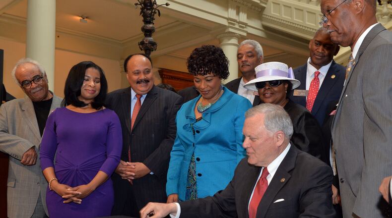 APRIL 29, 2014 ATLANTA With Martin Luther King III, his wife, Arndrea, sister Bernice and members of the General Assembly, Governor Nathan Deal signs legislation related to the Martin Luther King Jr tribute statue (HB 1080) at the state Capitol Tuesday, April 29, 2014. Tuesday marks the last day the governor can sign bills into law. KENT D. JOHNSON/KDJOHNSON@AJC.COM With Martin Luther King III, his wife, Arndrea, sister Bernice and members of the General Assembly, Governor Nathan Deal signs legislation related to the Martin Luther King Jr tribute statue (HB 1080) at the state Capitol last April. Kent D. Johnson, kdjohnson@ajc.com