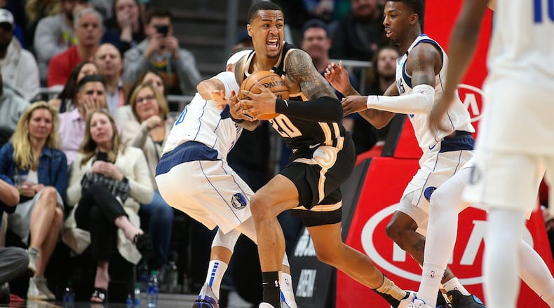 Atlanta Hawks forward John Collins (20) handles the ball in the second half of an NBA basketball game against the Dallas Mavericks, Saturday, Feb. 22, 2020, in Atlanta. (AP Photo/Brett Davis)
