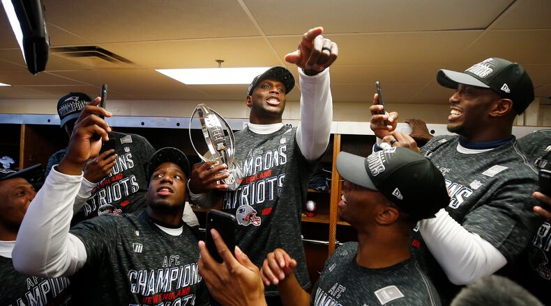 Does these guys look done to you? Various Patriots celebrate another AFC championship.
