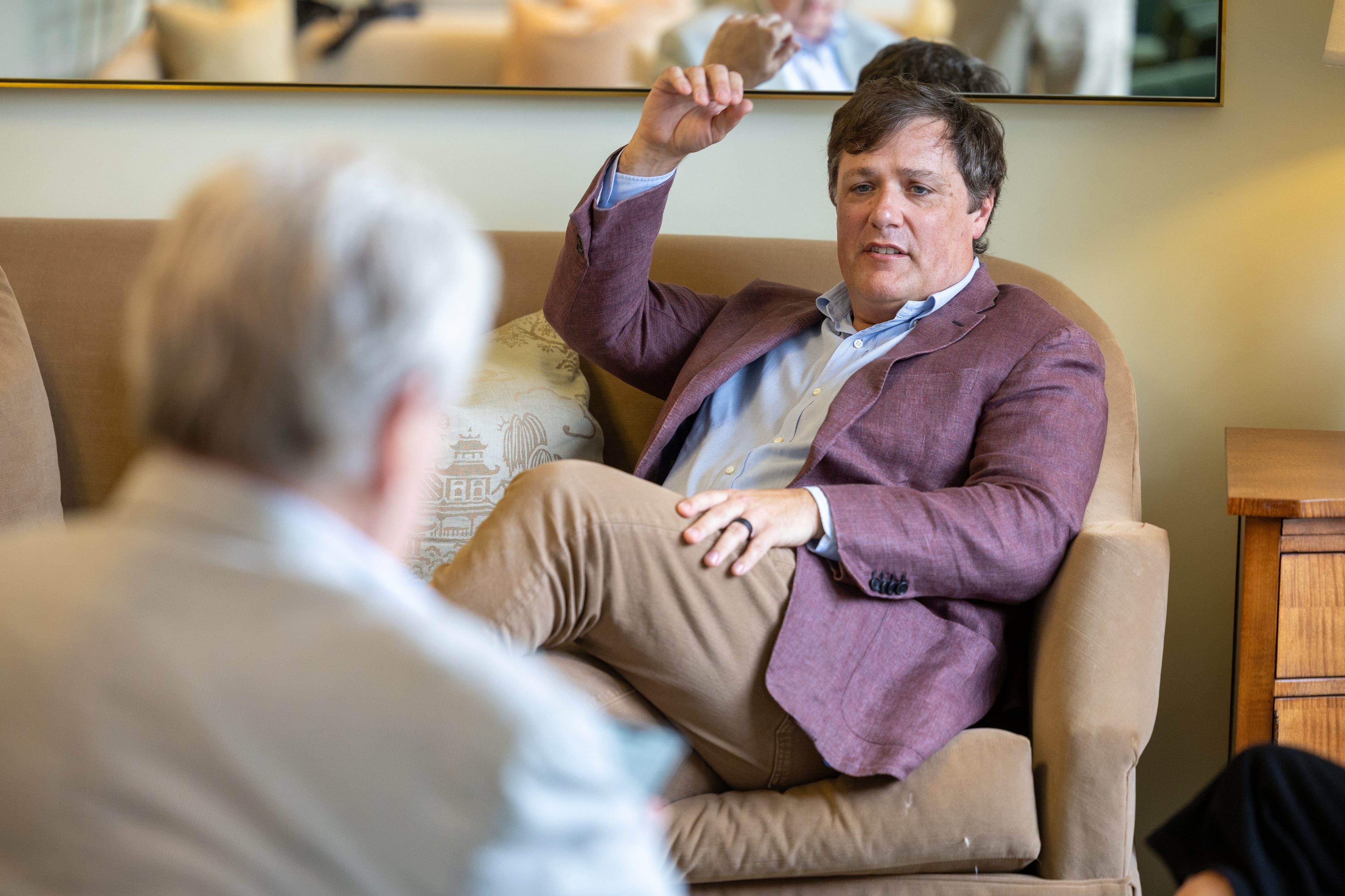 Patrick Wood (right) chats with Rip Sartain at the Dorsey Alston Realtors headquarters in Buckhead in June. (Phil Skinner/AJC)