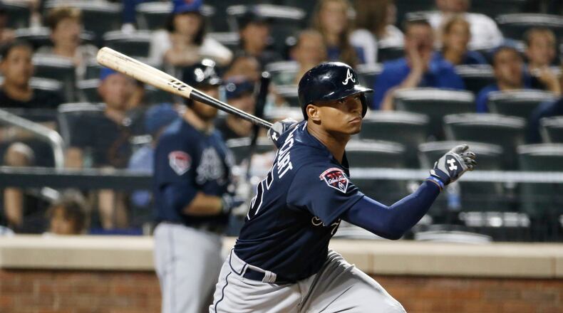 Atlanta Braves catcher Christian Bethancourt hits an eighth-inning RBI single that scored the Braves Chris Johson in a baseball game in New York, Monday, July 7, 2014. (AP Photo/Kathy Willens)