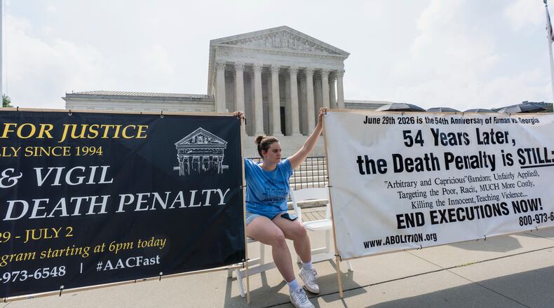 Activists and demonstrators wait outside the Supreme Court for the Justices to release opinions, in Washington, Monday, June 29, 2026. (AP Photo/J. Scott Applewhite)
