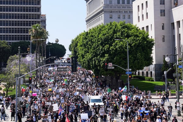 Protesters from the city hall to the metropolitan detention center of downtown Los Angeles, Sunday, June 8, 2025, following last night's immigration raid protest. (AP Photo/Jae Hong)