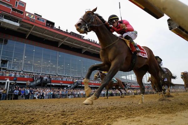 FILE - War of Will, ridden by Tyler Gaffalione, right, crosses the finish line first to win the Preakness Stakes horse race at Pimlico Race Course, Saturday, May 18, 2019, in Baltimore. (AP Photo/Steve Helber, File)