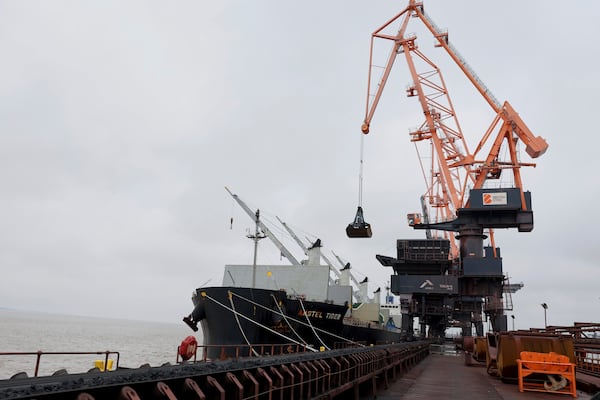 Coking coal is unloaded at Immingham Port, northern England, Tuesday, April 15, 2025. (Darren Staples/Pool Photo via AP)
