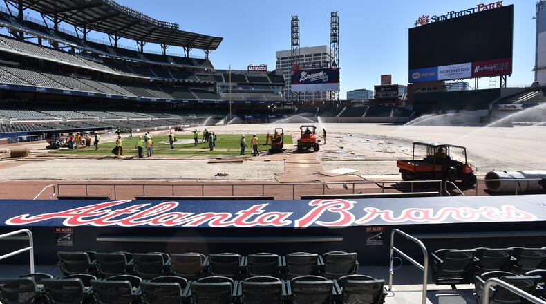 File Photo: Workers install sod in the infield at SunTrust Park on Saturday, March 4, 2017. HYOSUB SHIN / HSHIN@AJC.COM