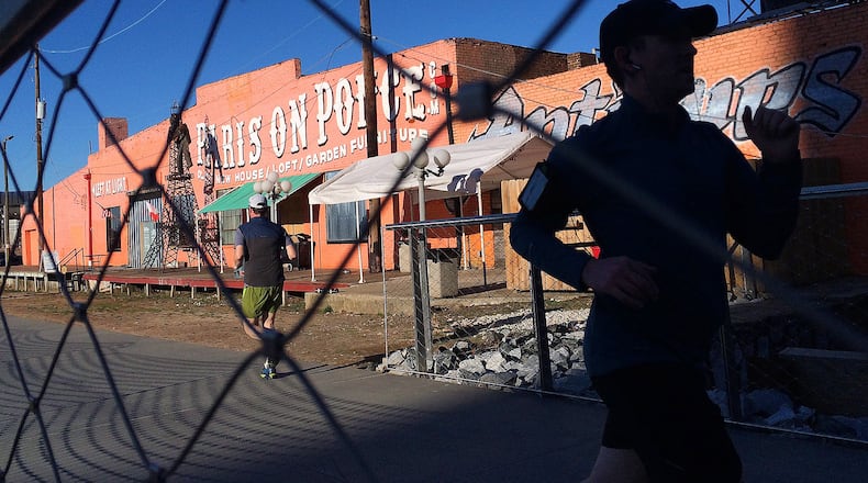 February 21, 2014 Atlanta: Runners make their way past Paris On Ponce as they use the Atlanta Beltline's Eastside Trail late Friday afternoon Febuary 21, 2014. BEN GRAY / BGRAY@AJC.COM