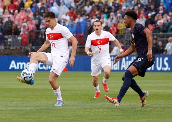 Turkey forward Kenan Yildiz (11) controls the ball ahead of United States defender Alex Freeman (16) during the first half of an international friendly soccer game, Saturday, June 7, 2025, in East Hartford, Conn. (AP Photo/Mary Schwalm)