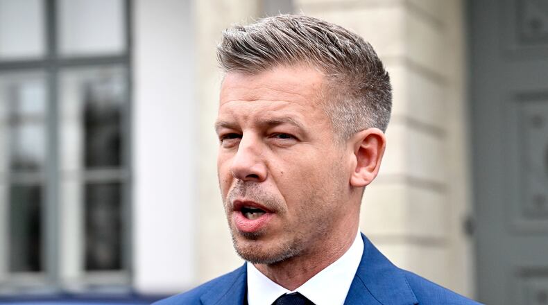 Peter Magyar, leader of the election-winning Tisza Party, talks to the media before meeting Hungarian President Tamas Sulyok in the presidential Alexander Palace in Budapest, Hungary, Wednesday April 15, 2026. (Robert Hegedus/MTI via AP)