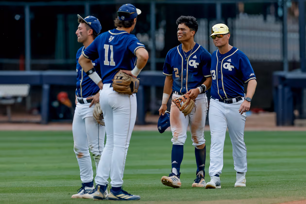 Georgia Tech head coach James Ramsey, right, consoles Jarren Advincula (2), Ryan Zuckerman (11) and Carson Kerce (3), after Oklahoma hit a solo home run against Tech during the 10th inning to win the NCAA D1 Atlanta Regional elimination baseball game at Russ Chandler Stadium, Monday, June 1, 2026, in Atlanta. (Erik S. Lesser for the AJC)