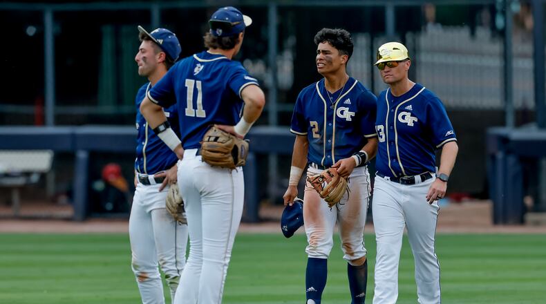 Georgia Tech head coach James Ramsey, right, consoles Jarren Advincula (2), Ryan Zuckerman (11) and Carson Kerce (3), after Oklahoma hit a solo home run against Tech during the 10th inning to win the NCAA D1 Atlanta Regional elimination baseball game at Russ Chandler Stadium, Monday, June 1, 2026, in Atlanta. (Erik S. Lesser for the AJC)