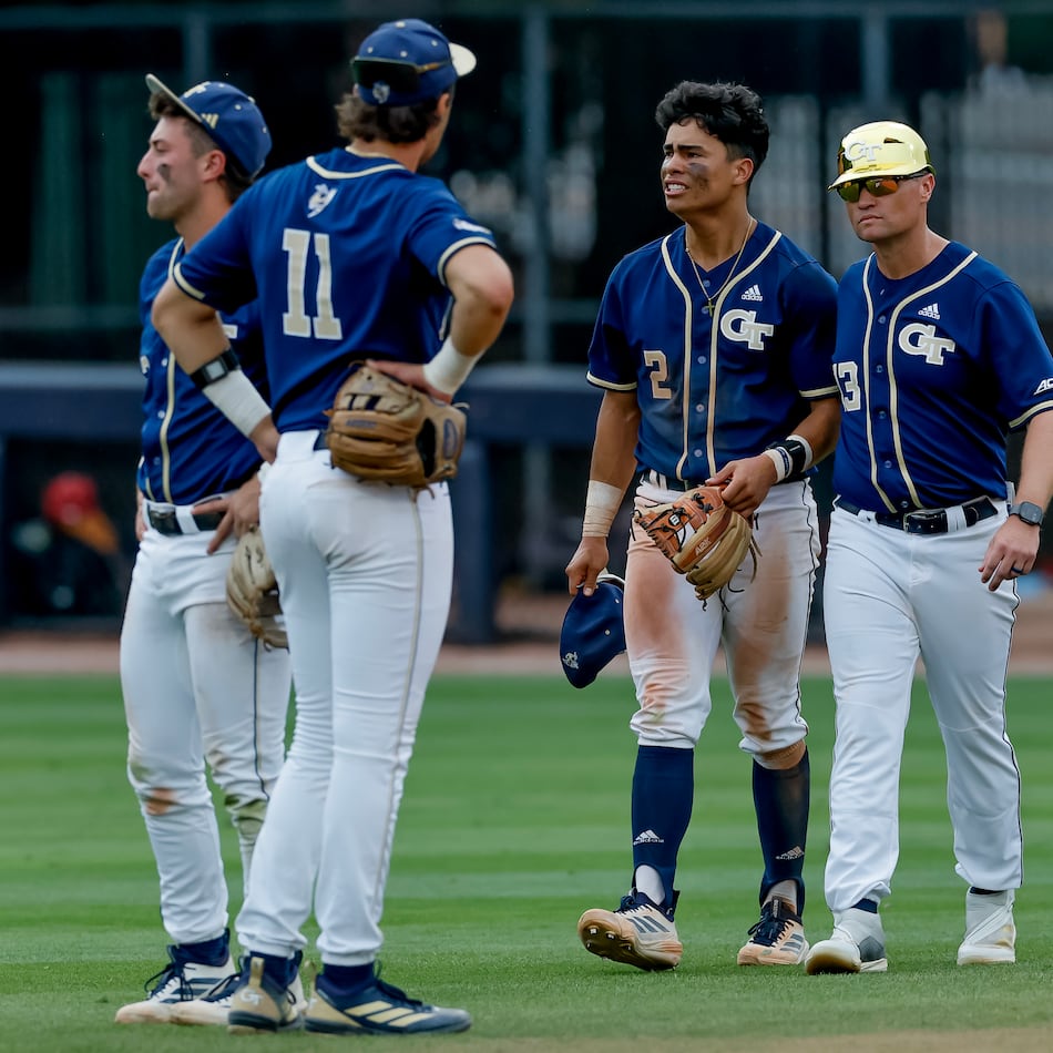 Georgia Tech head coach James Ramsey, right, consoles Jarren Advincula (2), Ryan Zuckerman (11) and Carson Kerce (3), after Oklahoma hit a solo home run against Tech during the 10th inning to win the NCAA D1 Atlanta Regional elimination baseball game at Russ Chandler Stadium, Monday, June 1, 2026, in Atlanta. (Erik S. Lesser for the AJC)