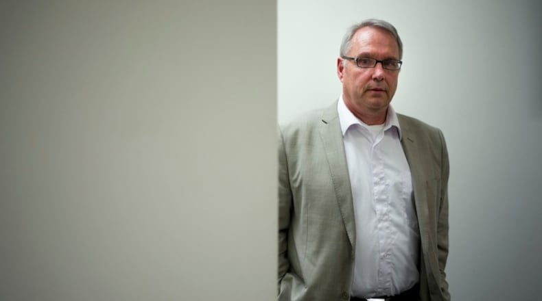 Attorney William Johnson, a leader of the American Freedom Party and self-proclaimed white nationalist, pauses for photos in his office, Tuesday, May 10, 2016, in Los Angeles. Donald Trump's campaign says a computer problem resulted in the prominent white nationalist being included on a list of his potential California delegates. The campaign says the name has been withdrawn and a corrected list resubmitted to state officials. (AP Photo/Jae C. Hong)