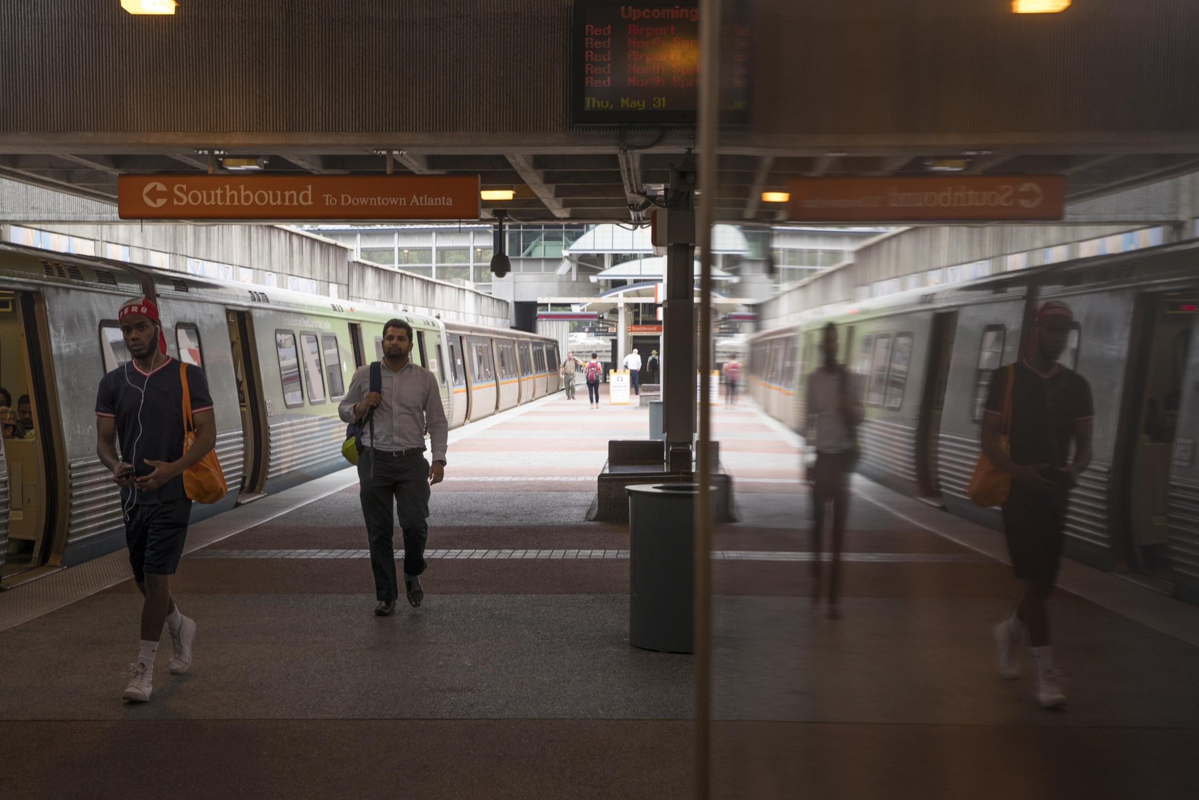 Morning commuters exit a southbound MARTA train at the Buckhead transit station in Atlanta, Thursday, May 31, 2018. (Alyssa Pointer/AJC)