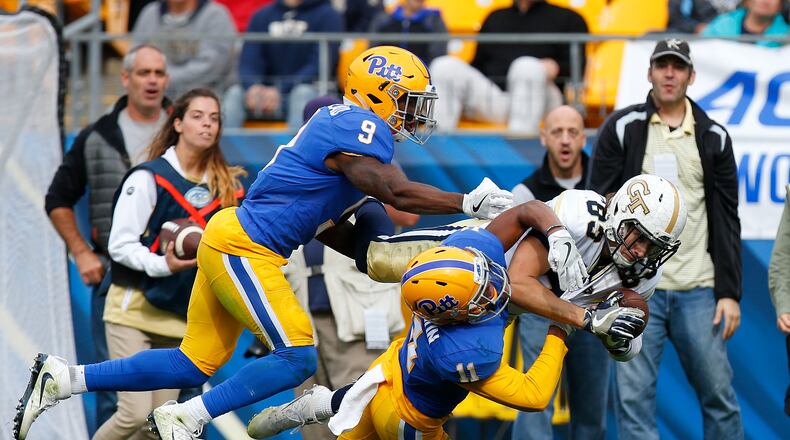 Brad Stewart #83 of the Georgia Tech Yellow Jackets pulls in the pass against Dane Jackson #11 and Jordan Whitehead #9 of the Pittsburgh Panthers in the second half on October 8, 2016 at Heinz Field in Pittsburgh, Pennsylvania. (Photo by Justin K. Aller/Getty Images)