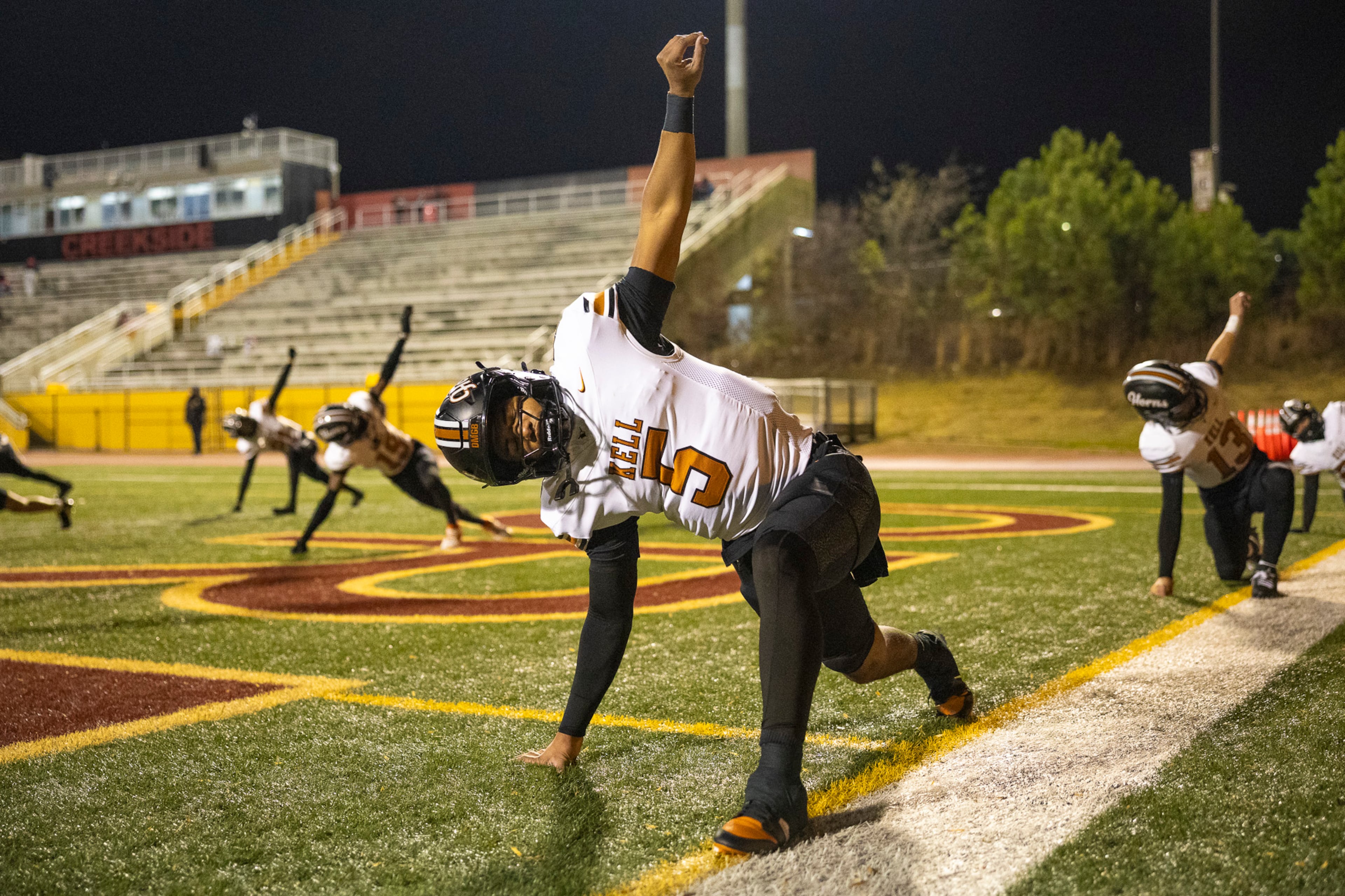 Kell quarterback Kaleb Narcisse (5) stretches during the warmups of the class 4A semifinal against Creekside at Creekside High School in Fairburn, GA on Friday, December 5, 2025. (Oscar Guevara Saenz for the AJC)