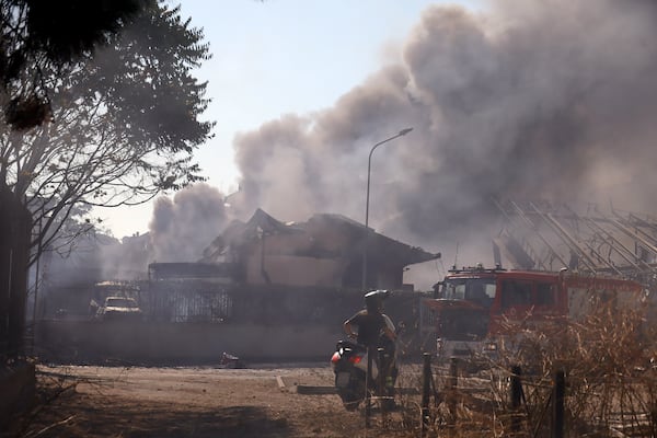 Smoke rises after a gas station exploded on the outskirts of Rome, Friday, July 4, 2025. (Cecilia Fabiano/LaPresse via AP)