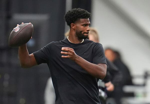 FILE - Colorado quarterback Shedeur Sanders (2) takes part in passing drills during Colorado's NFL football pro day Friday, April 4, 2025, in Boulder, Colo. (AP Photo/David Zalubowski,File)