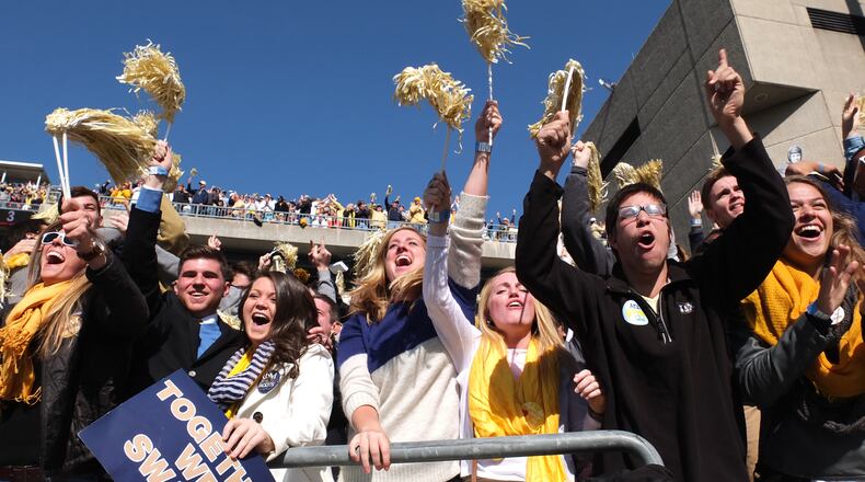 November 15, 2014 Atlanta - Georgia Tech Yellow Jackets fans cheer after Georgia Tech Yellow Jackets defensive back Jamal Golden (4) scored a touchdown against the Clemson Tigers in the first half at Bobby Dodd Stadium on Saturday, November 15, 2014. HYOSUB SHIN / HSHIN@AJC.COM