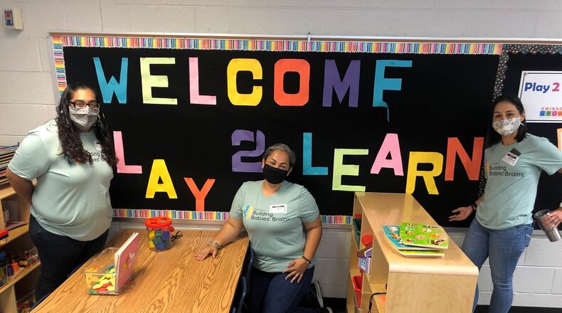 BBB ambassadors Rosalinda Perez (left) and Paola Aramendiz (middle) share information with GCPS Early Learning Specialist Carolina Worthington (right) at one of the three Gwinnett County Public Schools flagship programs called Play 2 Learn - a condensed pre-school experience teaching parents to be that teacher at home.