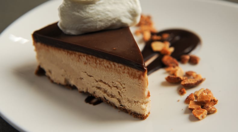Peanut butter pie with graham cracker crust, candied peanuts and whipped cream at Common Quarter in Marietta. (BECKY STEIN)