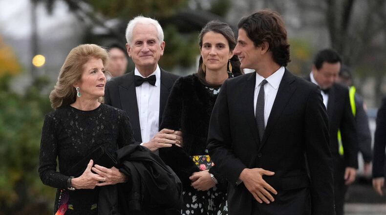 FILE - Caroline Kennedy, ambassador of the United States to Australia, left, arrives with her husband, Edwin Schlossberg, center left, and her children, Tatiana Schlossberg, center right, and Jack Schlossberg, right, Sunday, Oct. 29, 2023, before the presentation ceremony for the John F. Kennedy Profile in Courage Award at the John F. Kennedy Presidential Library and Museum, in Boston. (AP Photo/Steven Senne, File)