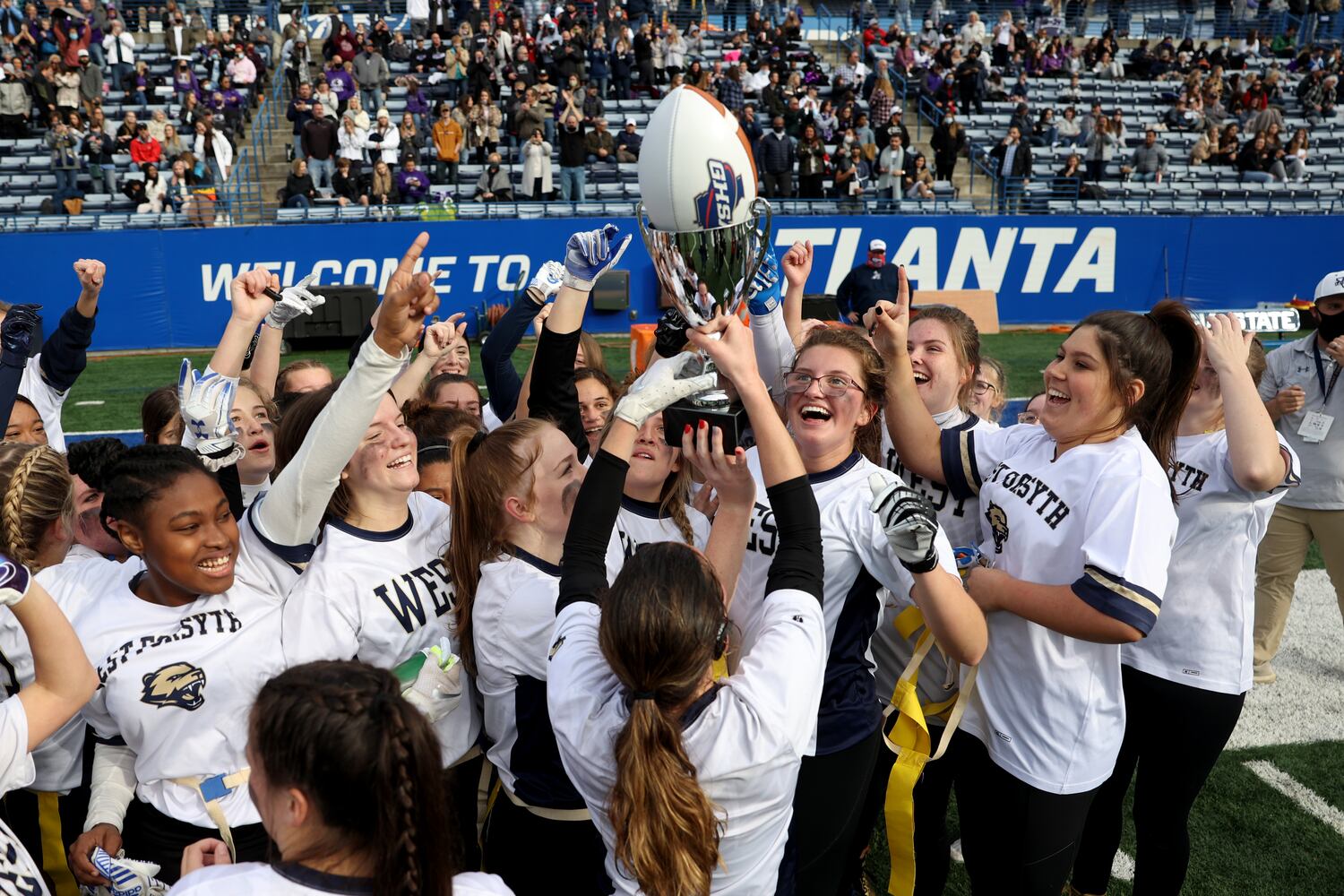 West Forsyth celebrates after their 26-25 2-OT win against Hillgrove in the Class 6A-7A Flag Football championship at Center Parc Stadium Monday, December 28, 2020 in Atlanta, Ga.. JASON GETZ FOR THE ATLANTA JOURNAL-CONSTITUTION