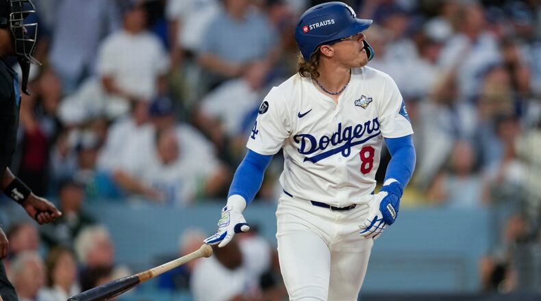 FILE - Los Angeles Dodgers' Kiké Hernández watches his home run take flight against the Toronto Blue Jays during the third inning in Game 5 of baseball's World Series, Wednesday, Oct. 29, 2025, in Los Angeles. (AP Photo/Ashley Landis, File)