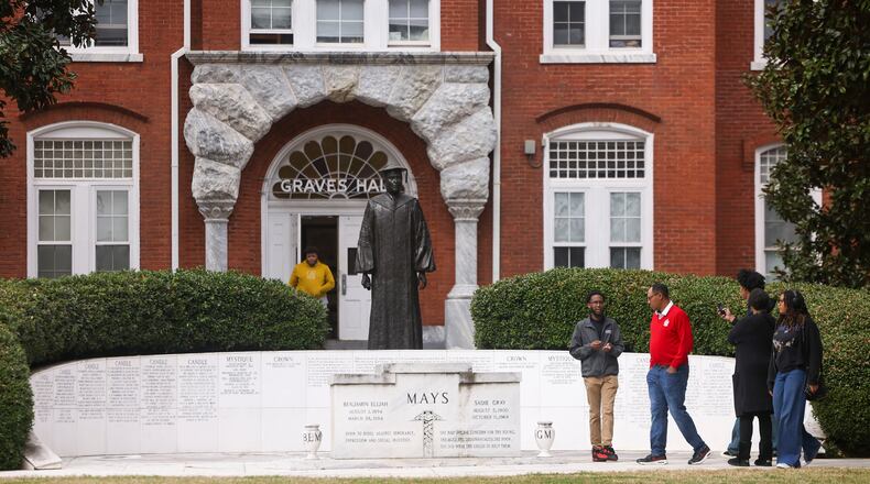 A tour guide ushers prospective students on March 18 near the Benjamin E. Mays Memorial in front of Graves Hall on the Morehouse College campus in Atlanta. (Jason Getz/The Atlanta Journal-Constitution/TNS)