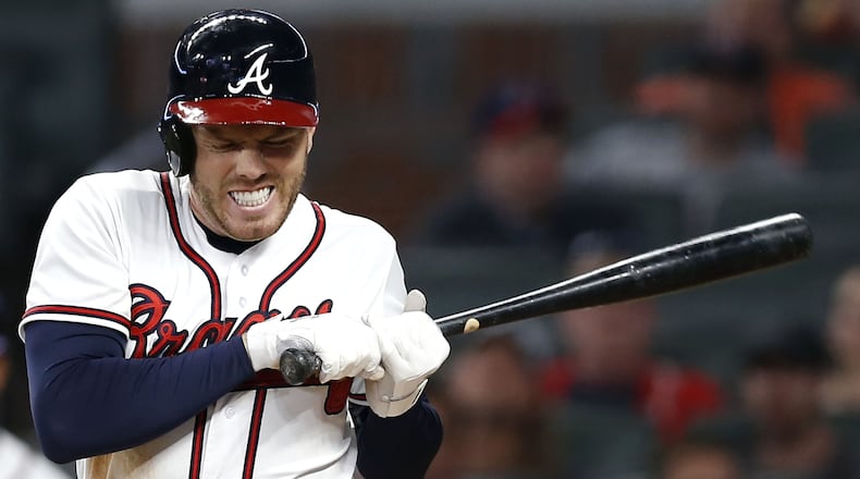 Braves first baseman Freddie Freeman reacts after getting hit by a pitch in the eighth inning Wednesday, April 18, 2018, against the Philadelphia Phillies at SunTrust Park in Atlanta.